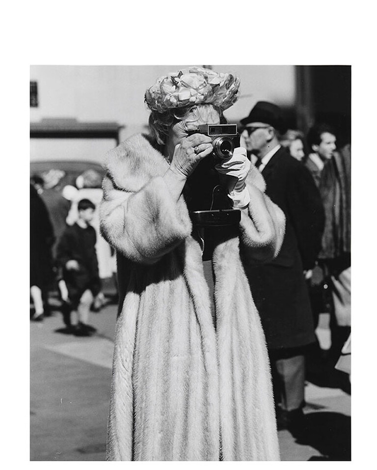 Woman in Fur Coat with Camera, Easter, St. Patrick's by Peter Hujar