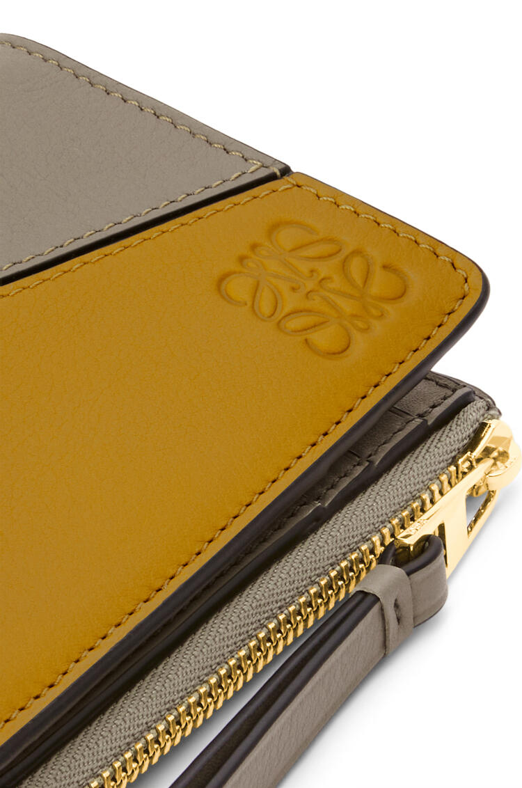 LOEWE Puzzle slim zip bifold wallet in classic calfskin Ochre/Laurel Green