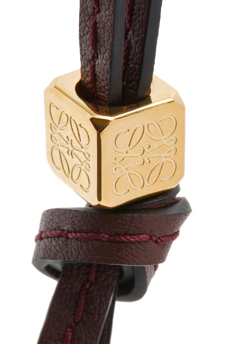 LOEWE Small Anagram strap in calfskin and brass Burgundy/Gold