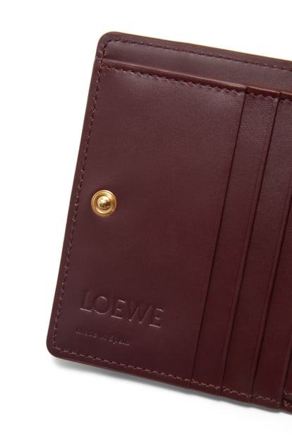 LOEWE Puzzle compact zip wallet in classic calfskin Burgundy/Vivid Orange plp_rd