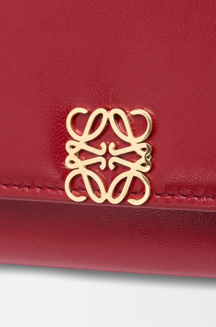 LOEWE Puffer Anagram small vertical wallet in shiny nappa calfskin Burnt Red