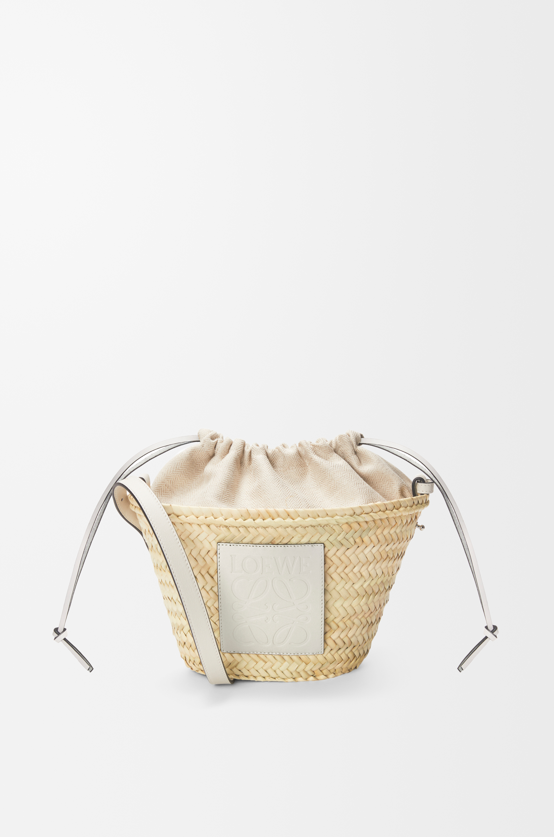 Shop LOEWE Drawstring bucket bag in palm leaf and calfskin